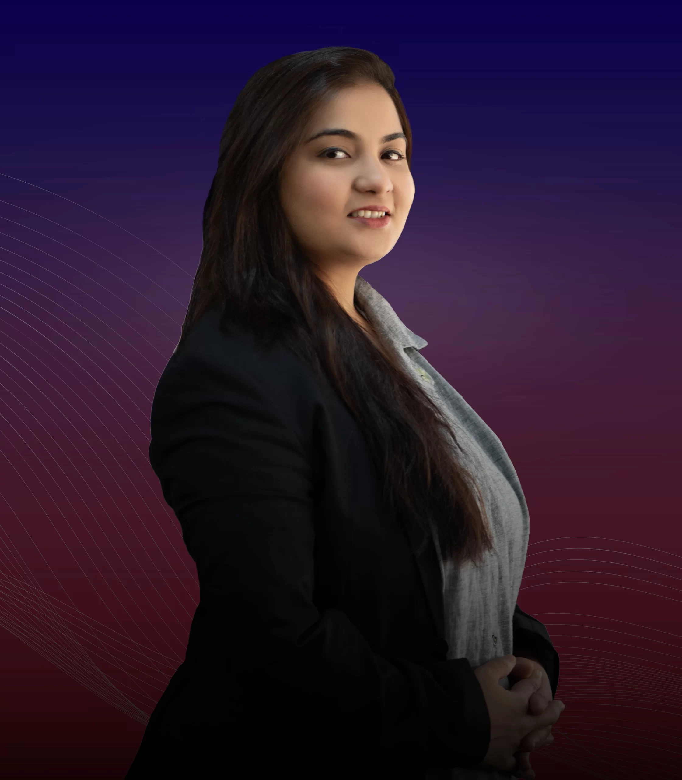 A professional woman in a business suit posing confidently against a vivid red and blue backdrop, embodying strength and success.